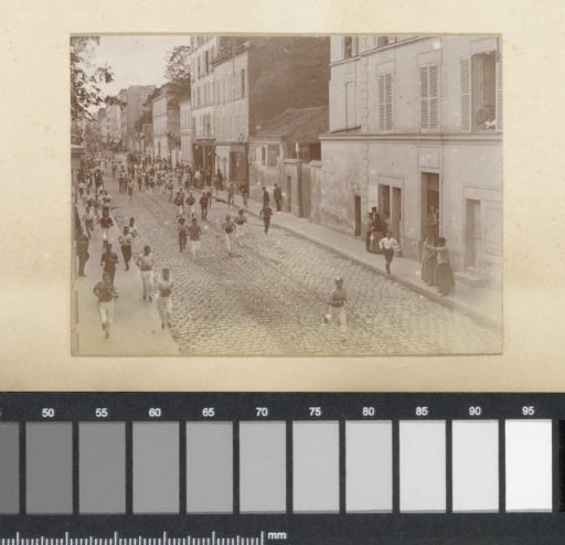 Running youths in a street in France