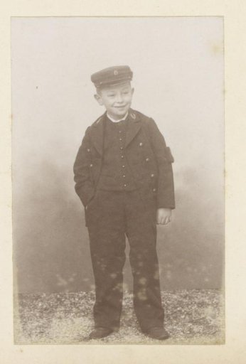 Portrait of a French boy in a uniform with cap