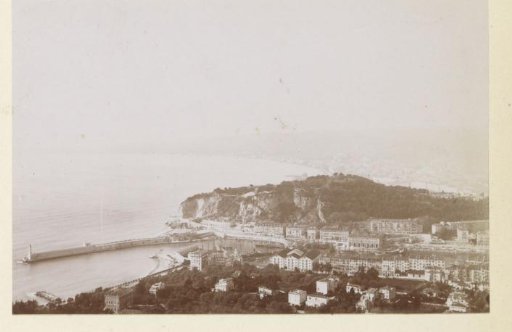 View of a harbor entrance with a lighthouse, probably on the coast of Southern France