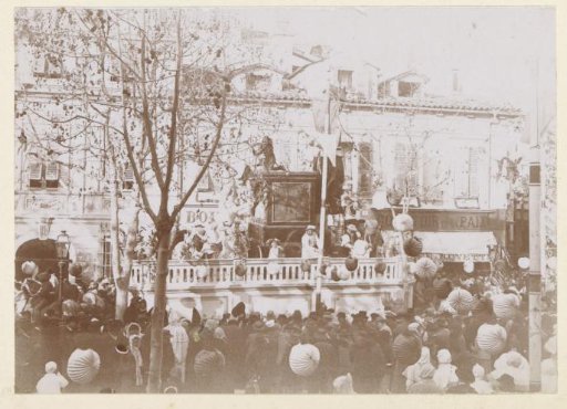 Procession with a pageant wagon and costumed people, possibly during the carnival in Nice