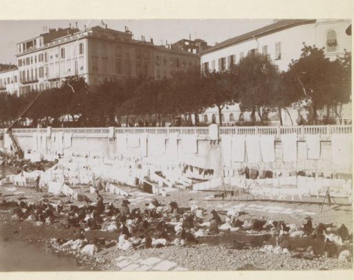 View of a shore with women doing laundry, probably in Southern France