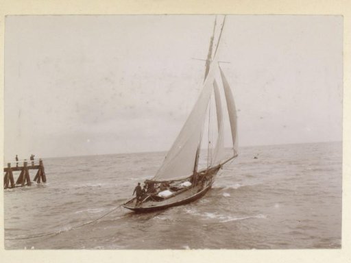 Sailing boat at a pier, probably on the French coast