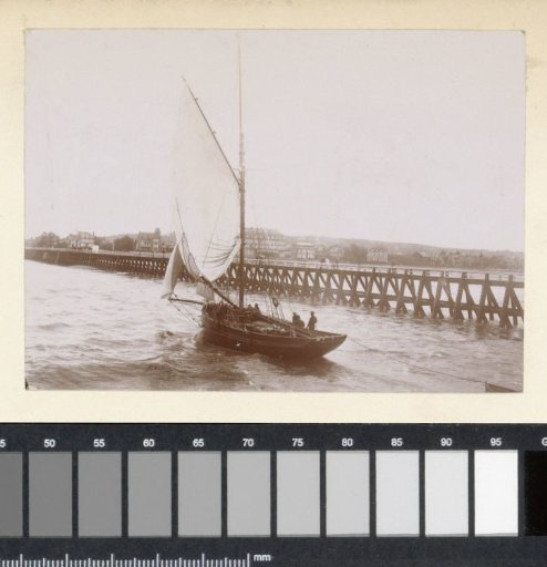 Sailing boat at a pier, probably on the French coast