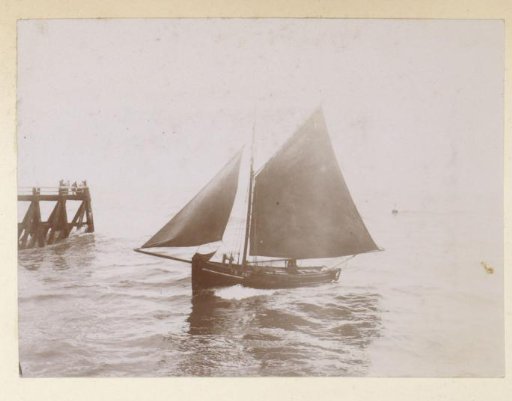 Sailing boat at a pier, probably on the French coast