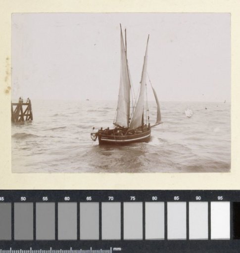 Sailing boat at a pier, probably on the French coast