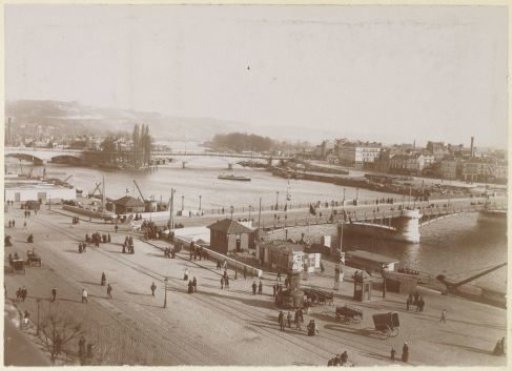 View of a city on a river, probably in France