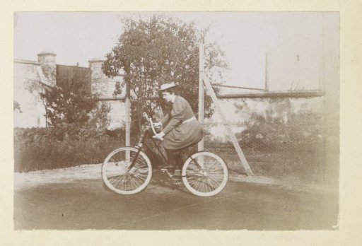 Woman cycling, probably in France