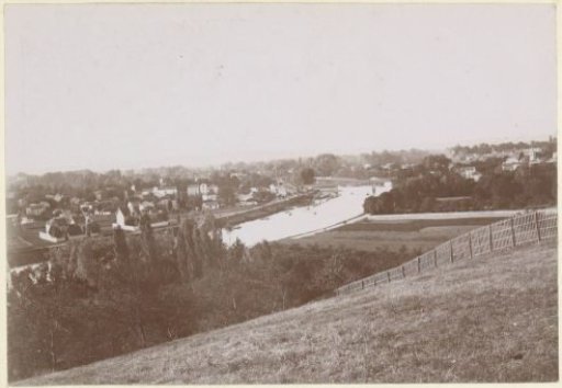 View of a village on a river, probably in France