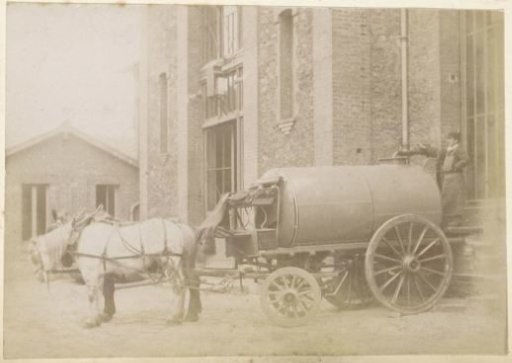 Horse, water cart and a soldier at a barracks in France