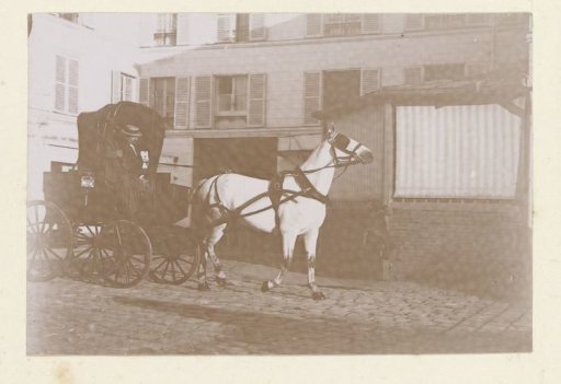 Carriage with horse on a courtyard in France