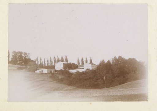 View of a hilly landscape with a villa in France