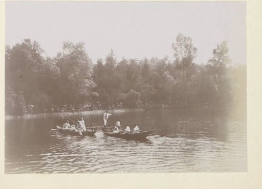Men in boats on a waterway in France