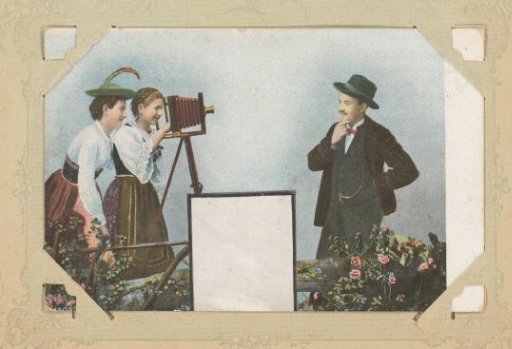 Two women by a camera and a posing man