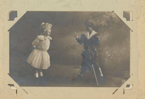 Girl sticking her tongue out at a boy with a camera