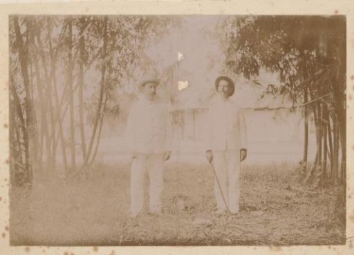 Two Dutch men in a garden