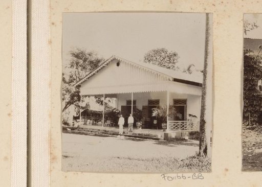 Man and woman before a house