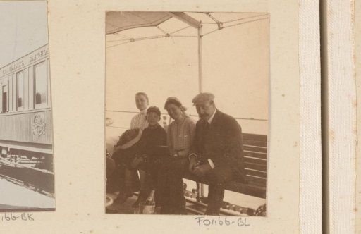 Two women, a man and a boy on a bench