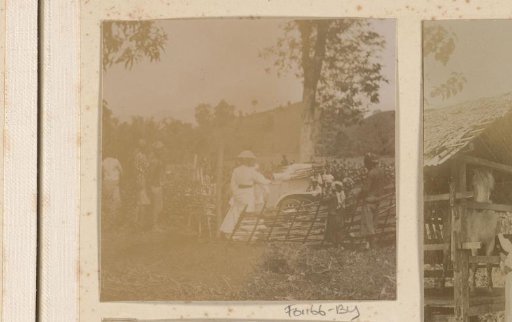 Dutch East Indies, Dutch woman by car with Indonesians around her