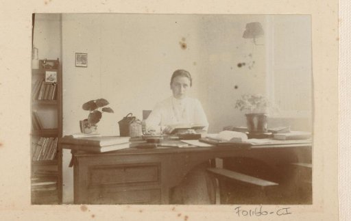 Woman sitting behind a desk