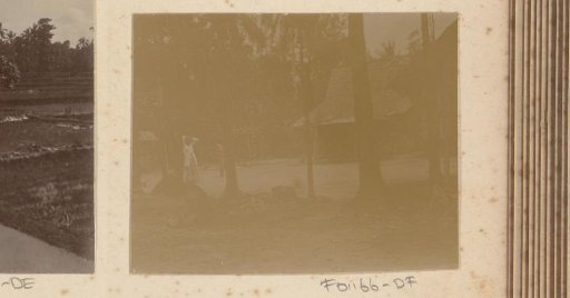 Woman by a house
