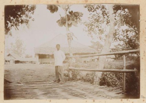 Dutch East Indies, Indonesian man on a wooden bridge