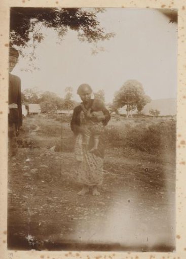 Man and woman with child in a field