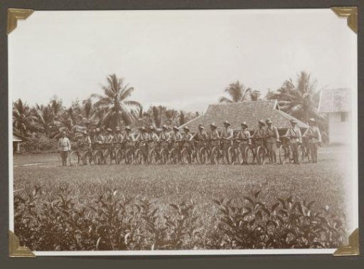 Group portrait of a police detachment with bicycles in Lampong