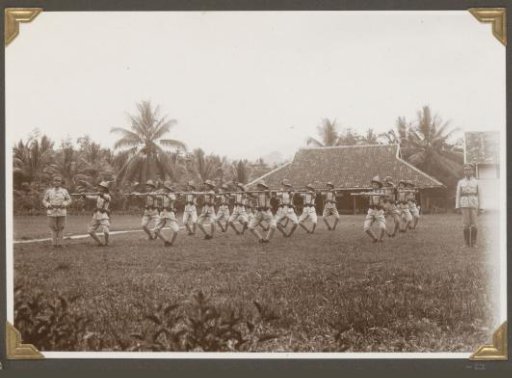Police officers doing gymnastic exercises with carbines in Lampong