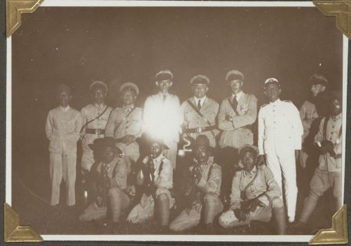Group portrait of the detachment 'Tandjongkarang' of the police in Lampong during an evening exercise