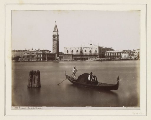 View of the Doge's Palace, the Campanile and surrounding buildings in Venice with a gondola in the foreground
