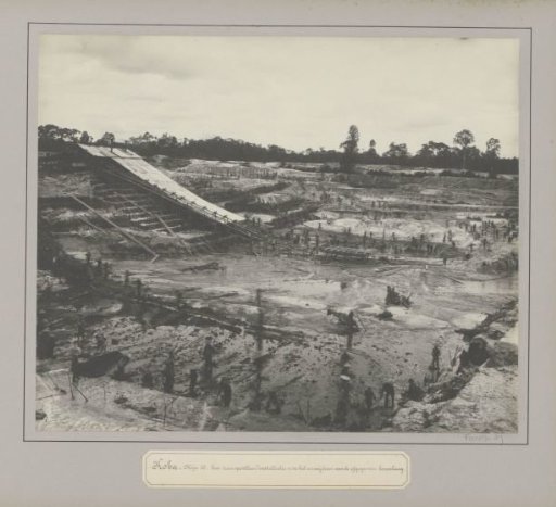 View of a tin mine in Koba with transport installation and miners