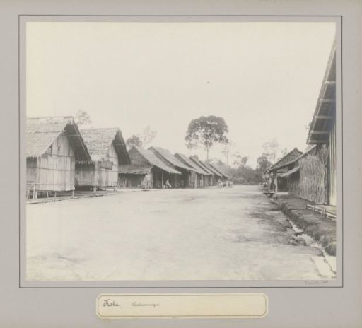 Housing for Chinese contract workers at a tin company in Koba, with a group of children in the background