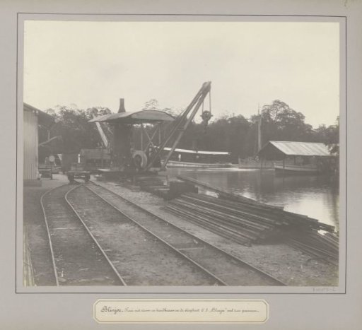 Quay with cranes and boats at a tin company in Belinyu