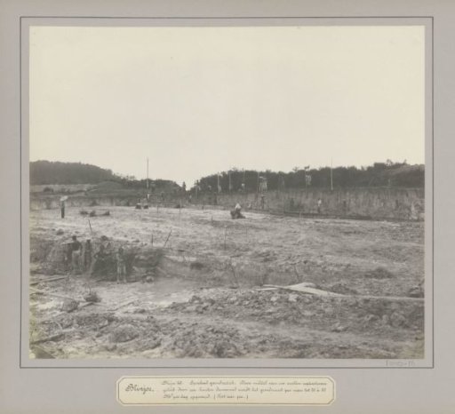 View of an open tin mine with workers in Belinyu