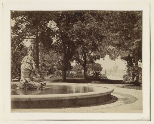 Fountain in the Pincian Gardens in Rome with a view through to St. Peter's Basilica on the right