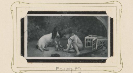 Child trying to teach a dog to read