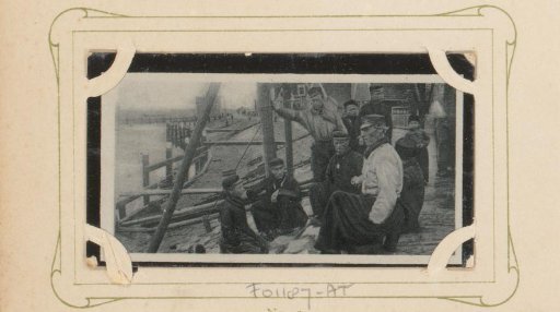 Group of Men and Boys on the Quay of a Waterway