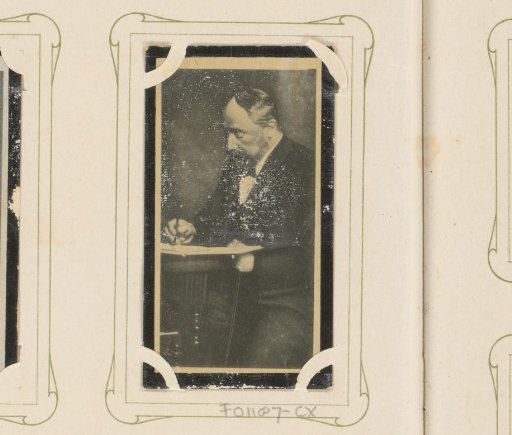 Portrait of Hendrik Willem Mesdag writing at a table