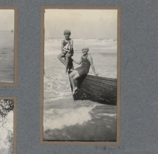 Two girls in bathing suits by the sea