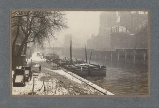 View of Paris in the snow with the Notre-Dame