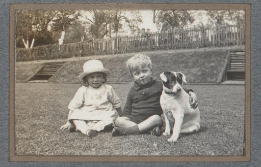 Portrait of two children with a dog