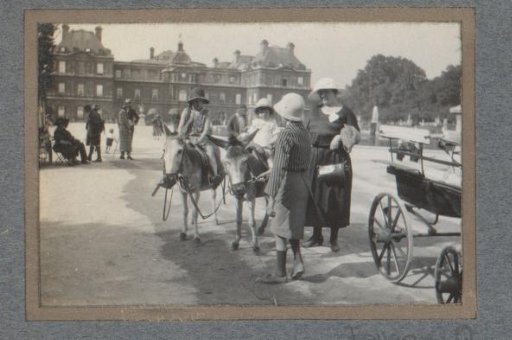 Children on donkeys in a French chateau park