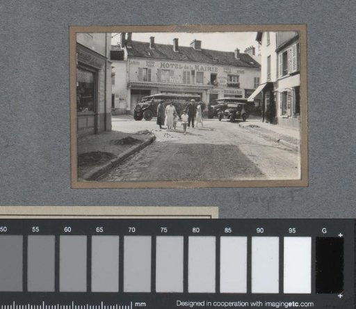 Street view in a French village with a family