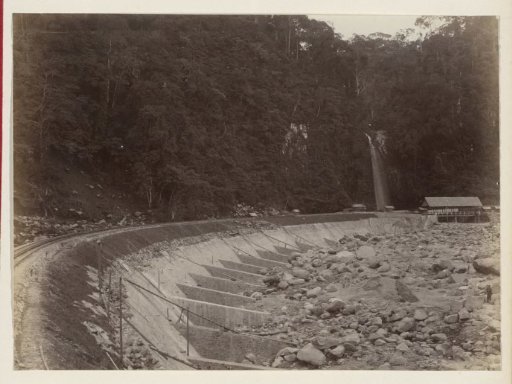 Embankment of a railway line near a riverbed in the Dutch East Indies