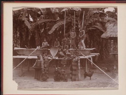 Group of Batak villagers with objects to process rice
