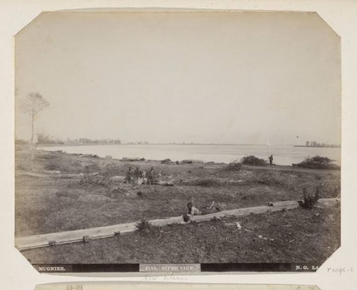 People on the bank of a river in New Orleans