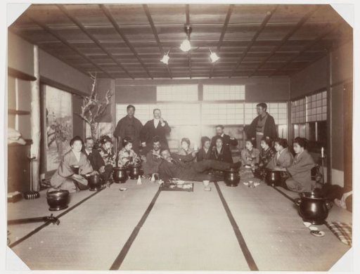 Europeans with geisha in a Japanese tea house