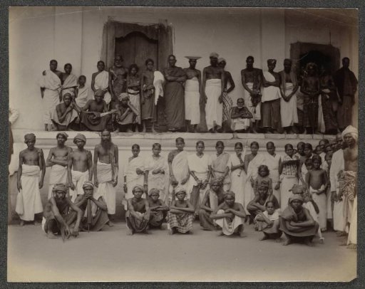 Men and women posing in front of a building, possibly in Ceylon