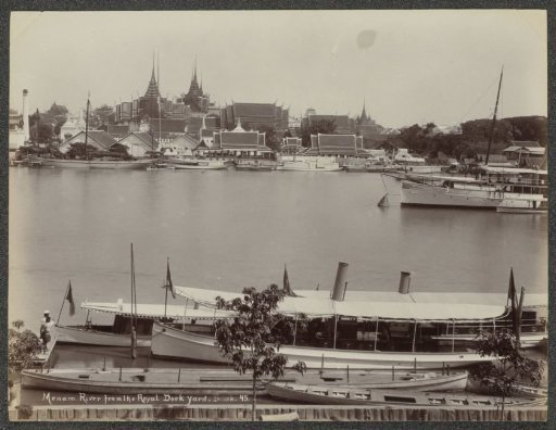 Menam River in Bangkok with buildings and boats, viewed from the Royal Dock Yard