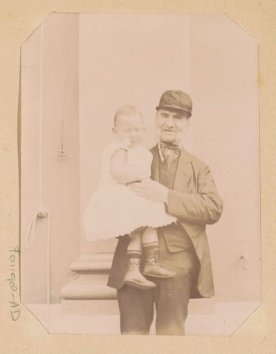 Portrait of an unknown old man with a toddler on his arm